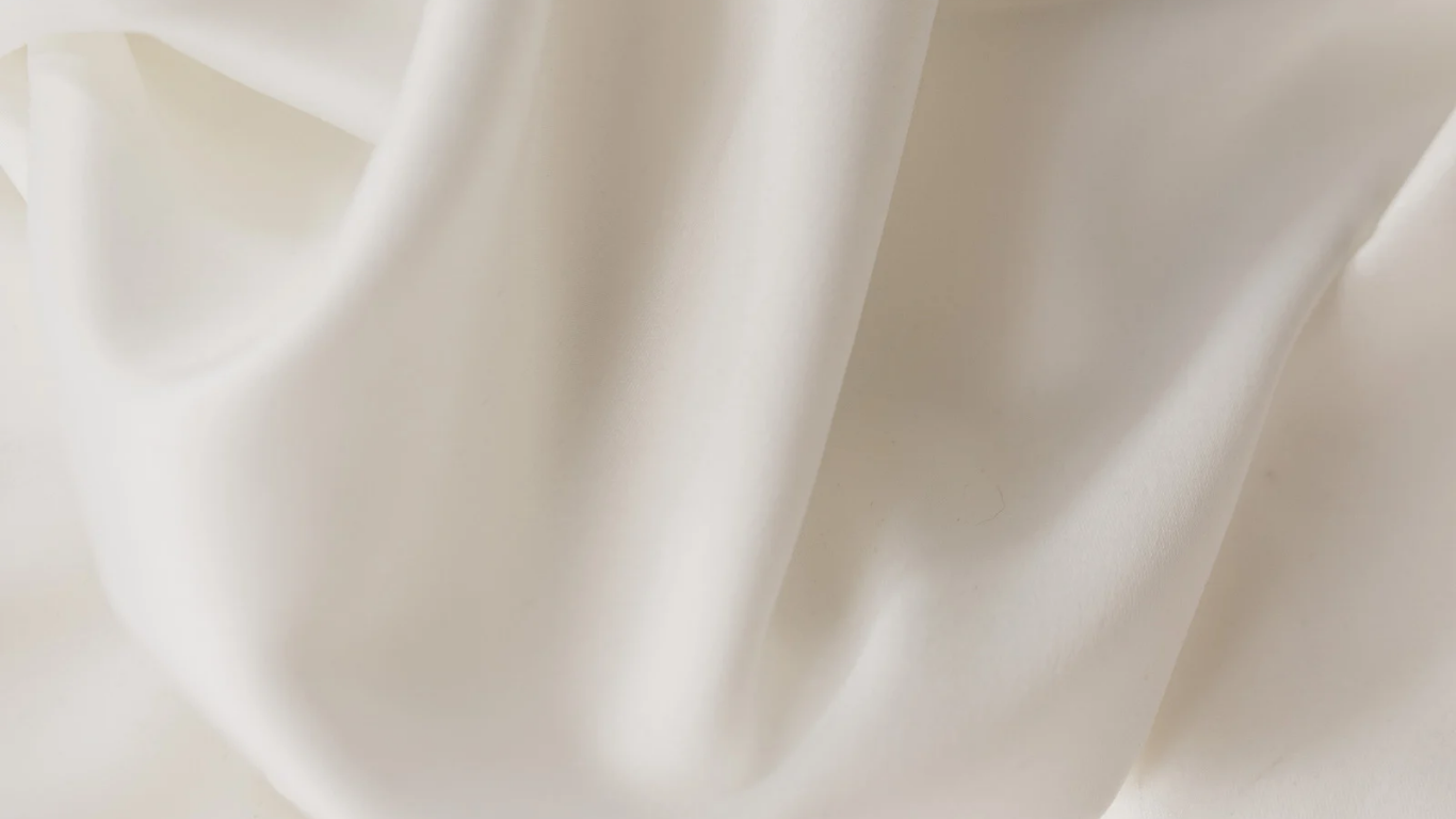 Close-up of beige fabric with soft folds